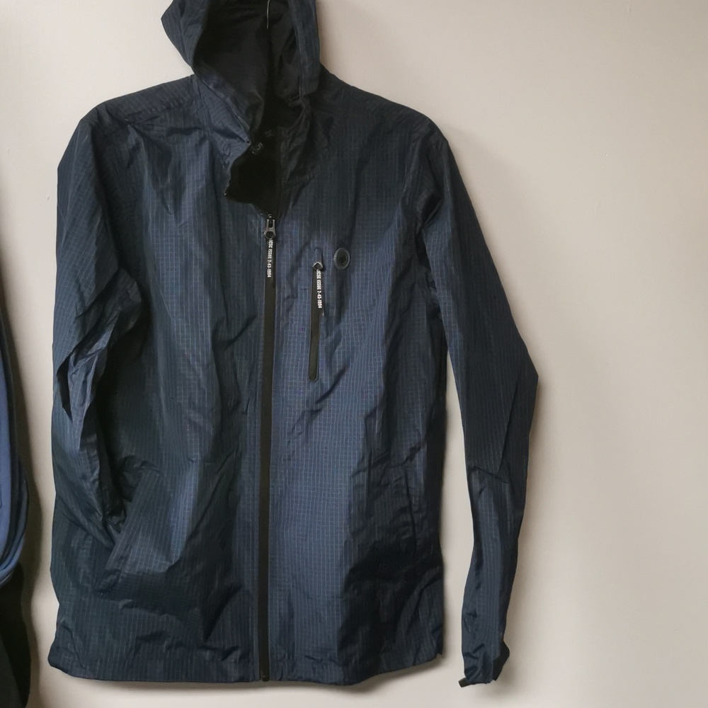 Brand new men's DC windbreaker, size small